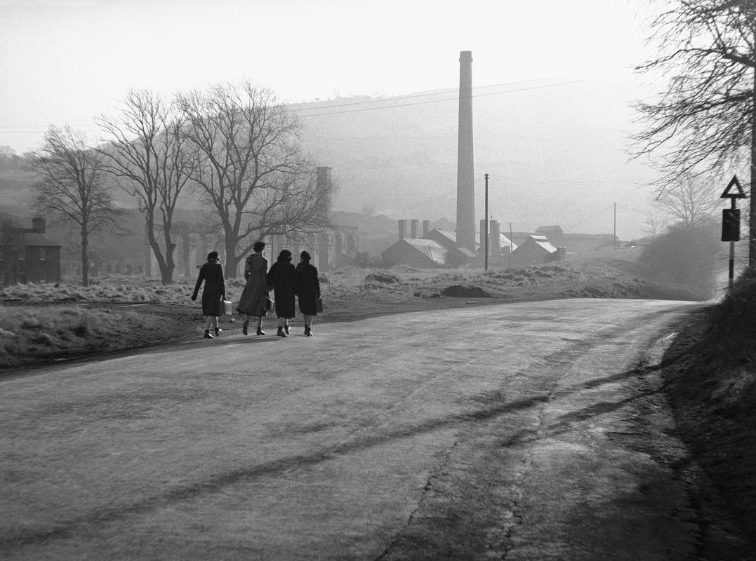 Four women walking along the road towards Ynyscedwyn tinplate works