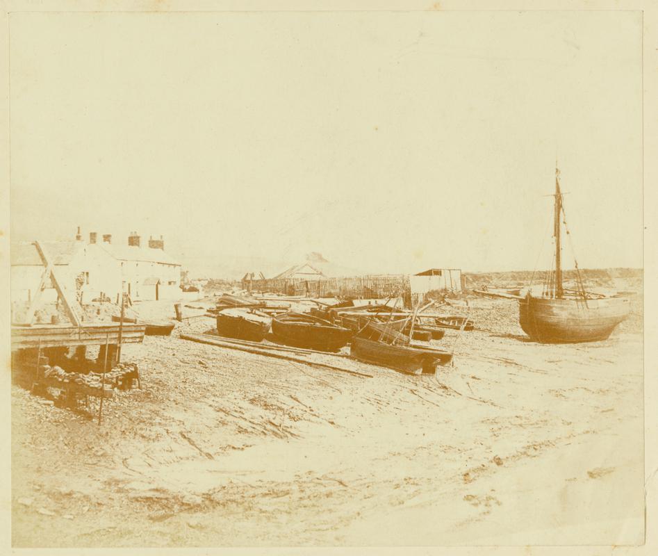 smack and boats on beach, photograph