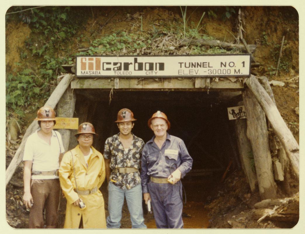 Mr Arthur Lewis with workers at a Philippino coal mine